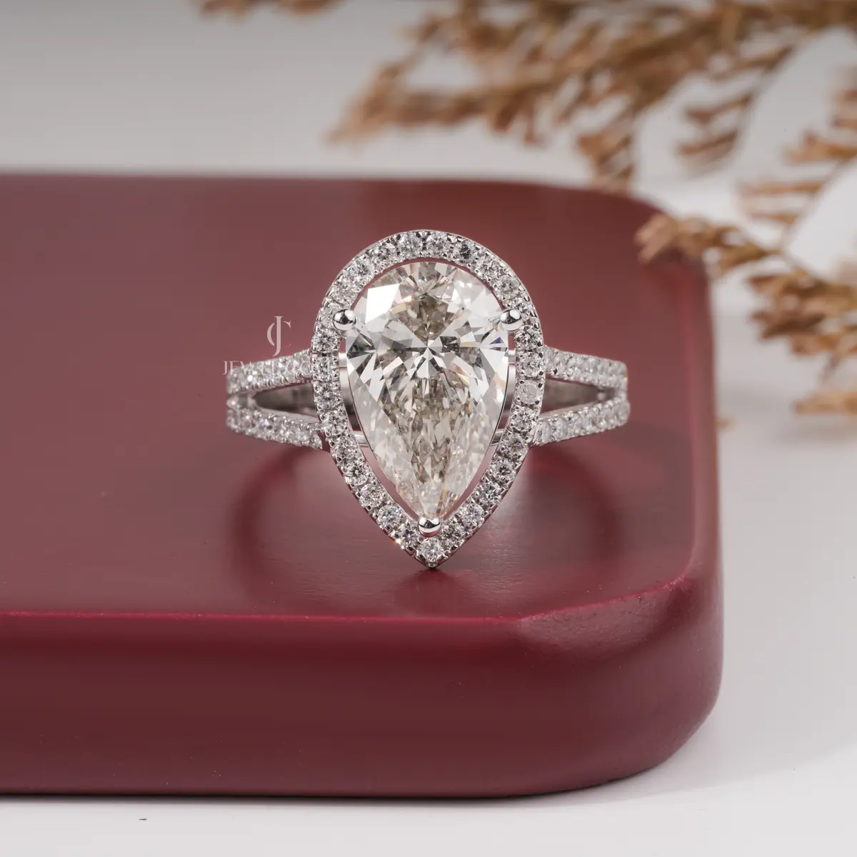 3 Carat pear diamond halo engagement ring with accent