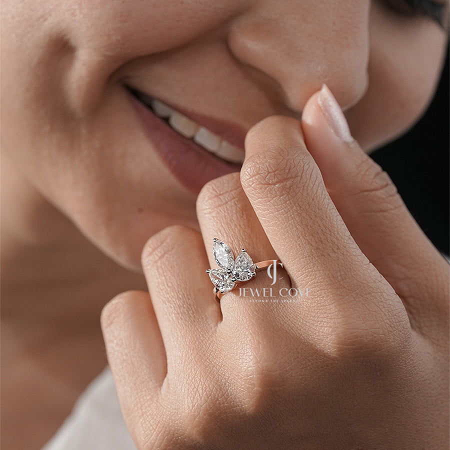 Elegant Marquise Triple Diamond Ring with Pear Side Diamond