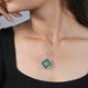 Elegant Green Pendant Necklace with Diamond Accents on Model (ONLY PENDENT)