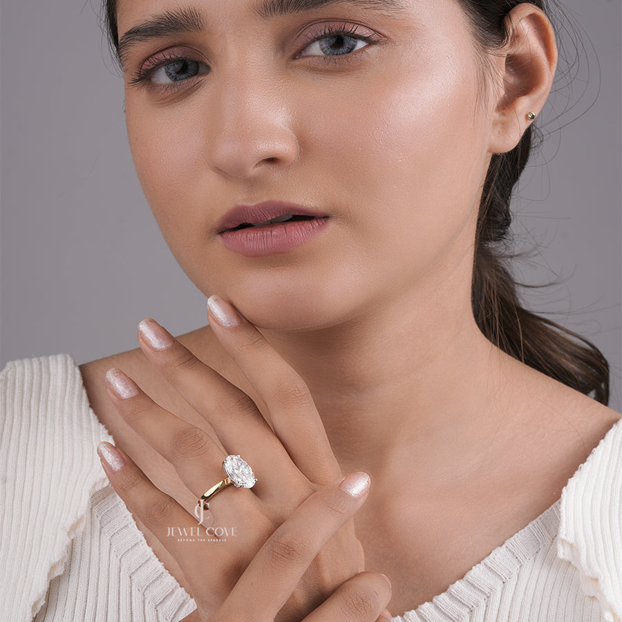 Oval Cut Diamond Engagement Ring with Classic Four-Prong Setting and Gold Band