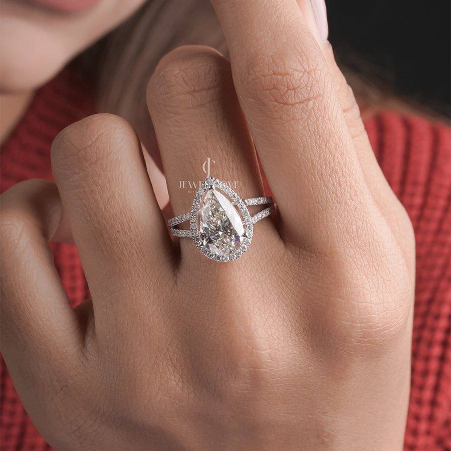3 Carat pear diamond halo engagement ring with accent