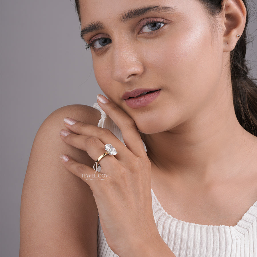 Oval Cut Diamond Engagement Ring with Classic Four-Prong Setting and Gold Band