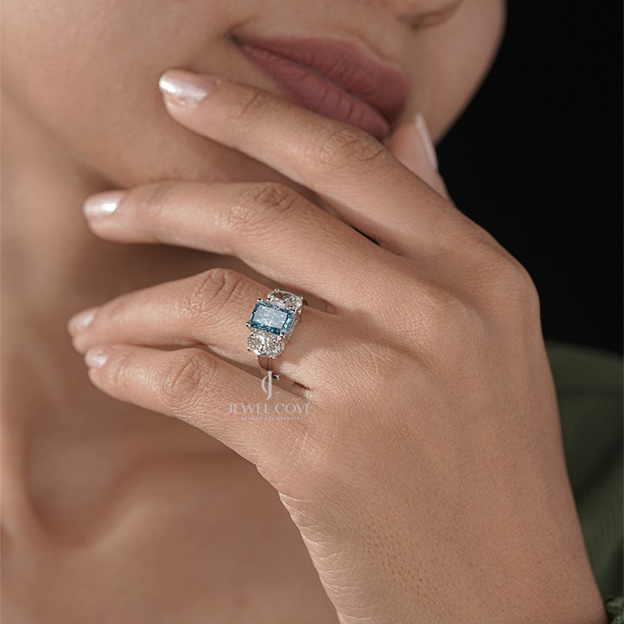 Three Stone Ring with Emerald Cut Blue Diamond and Oval Ring