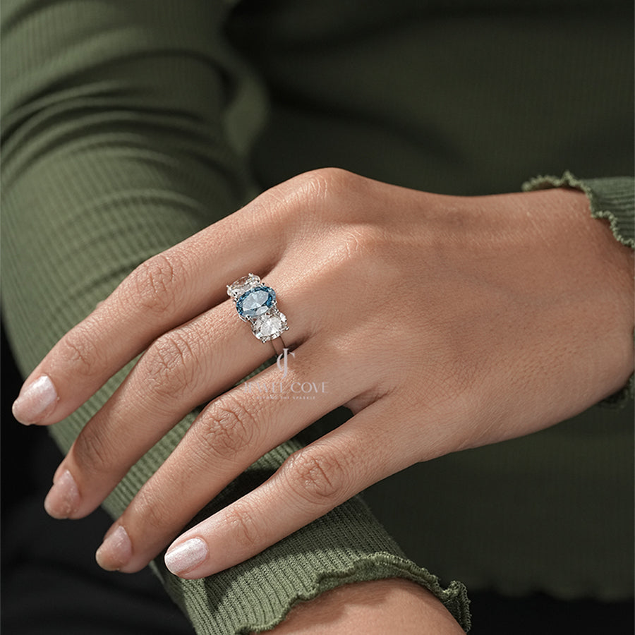 Three Stone Oval Ring with Blue Diamond and White Side Diamond