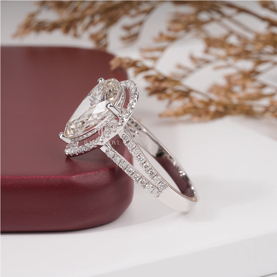 3 Carat pear diamond halo engagement ring with accent
