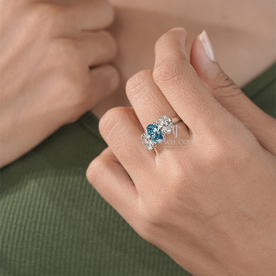 Three Stone Oval Ring with Blue Diamond and White Side Diamond