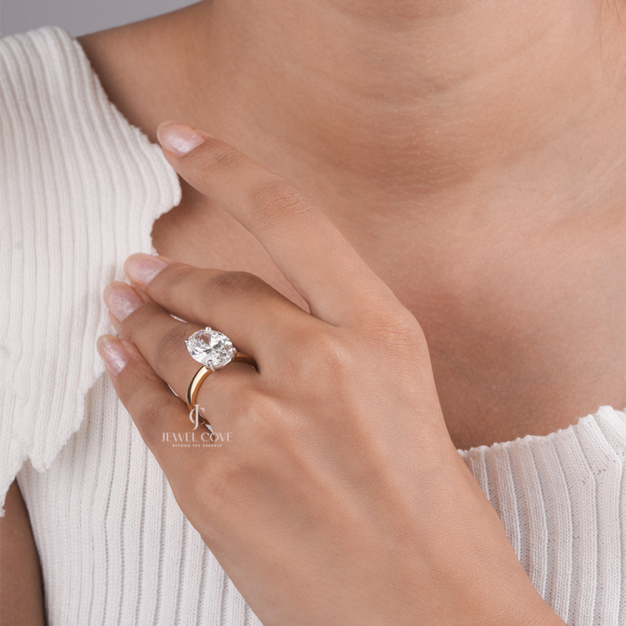 Oval Cut Diamond Engagement Ring with Classic Four-Prong Setting and Gold Band