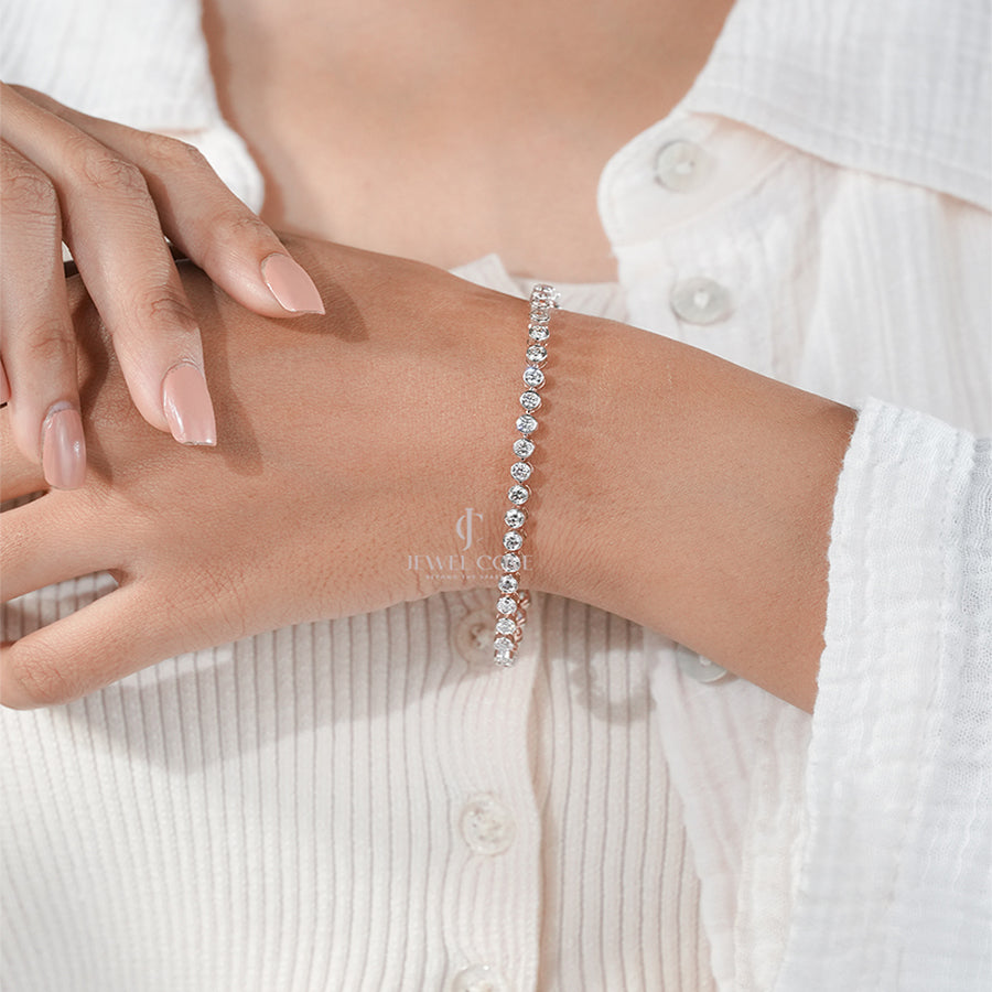 Classic White Gold Moissanite Tennis Bracelet on Woman’s Wrist – Luxury Jewelry Style