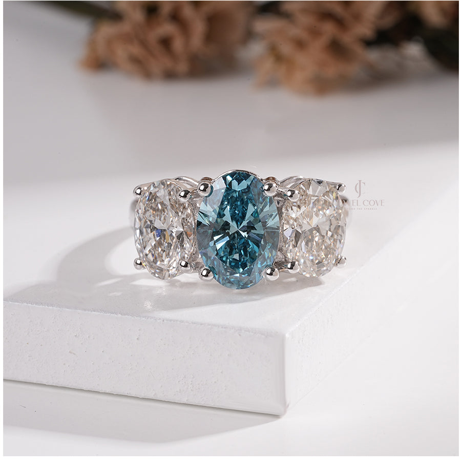 Three Stone Oval Ring with Blue Diamond and White Side Diamond