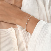 Elegant Diamond Tennis Bracelet on Woman’s Wrist – Minimalist Jewelry Style