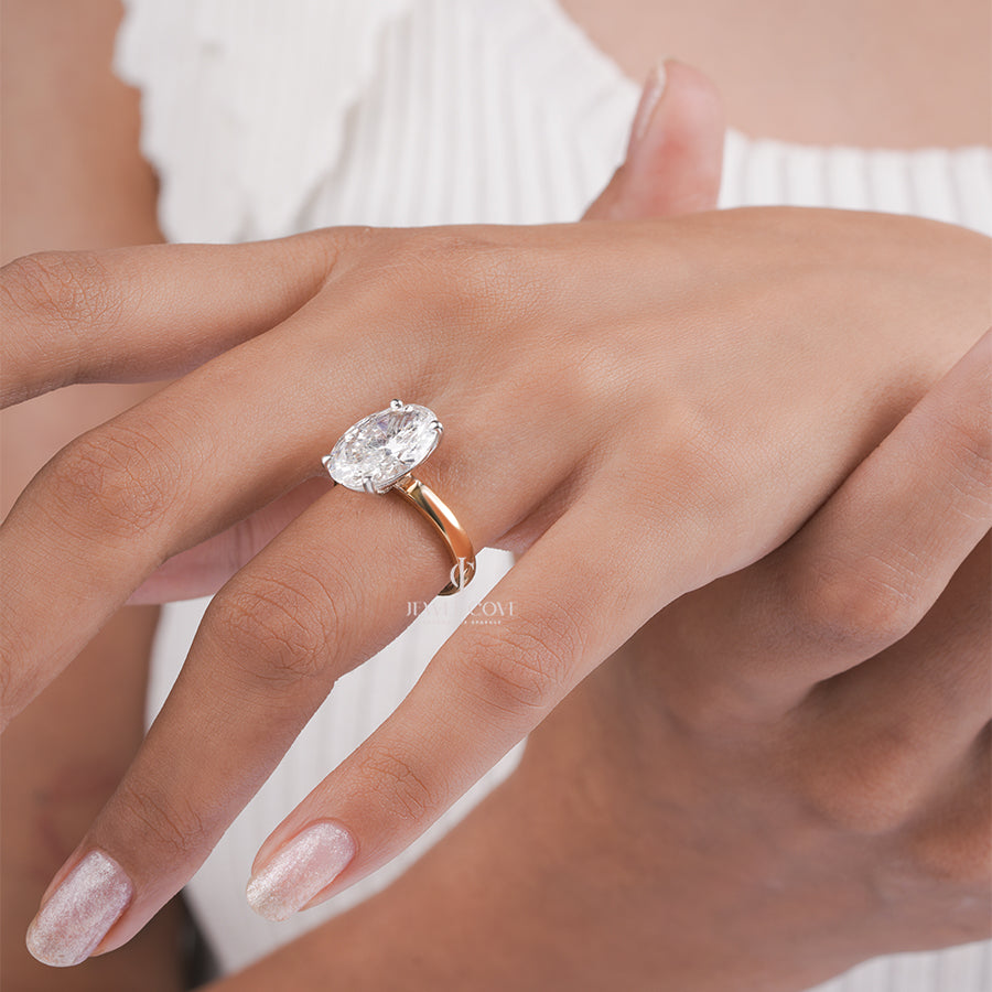 Oval Cut Diamond Engagement Ring with Classic Four-Prong Setting and Gold Band