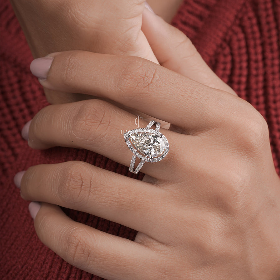 3 Carat pear diamond halo engagement ring with accent