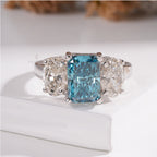 Three Stone Ring with Emerald Cut Blue Diamond and Oval Ring