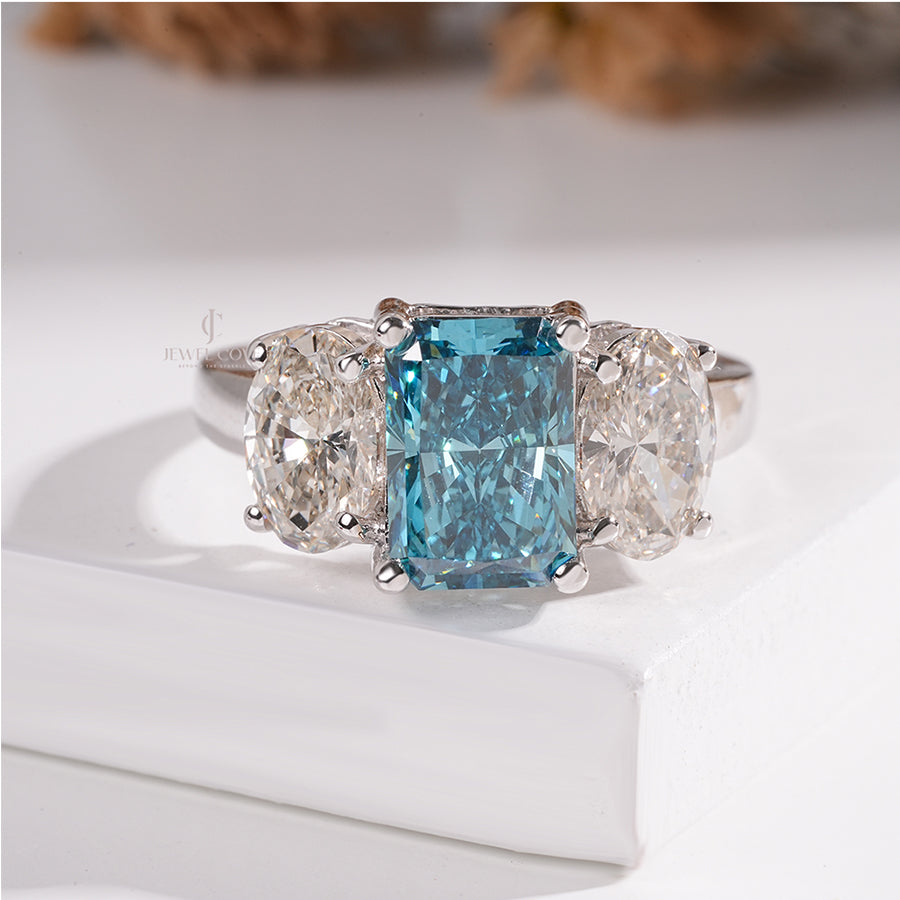 Three Stone Ring with Emerald Cut Blue Diamond and Oval Ring