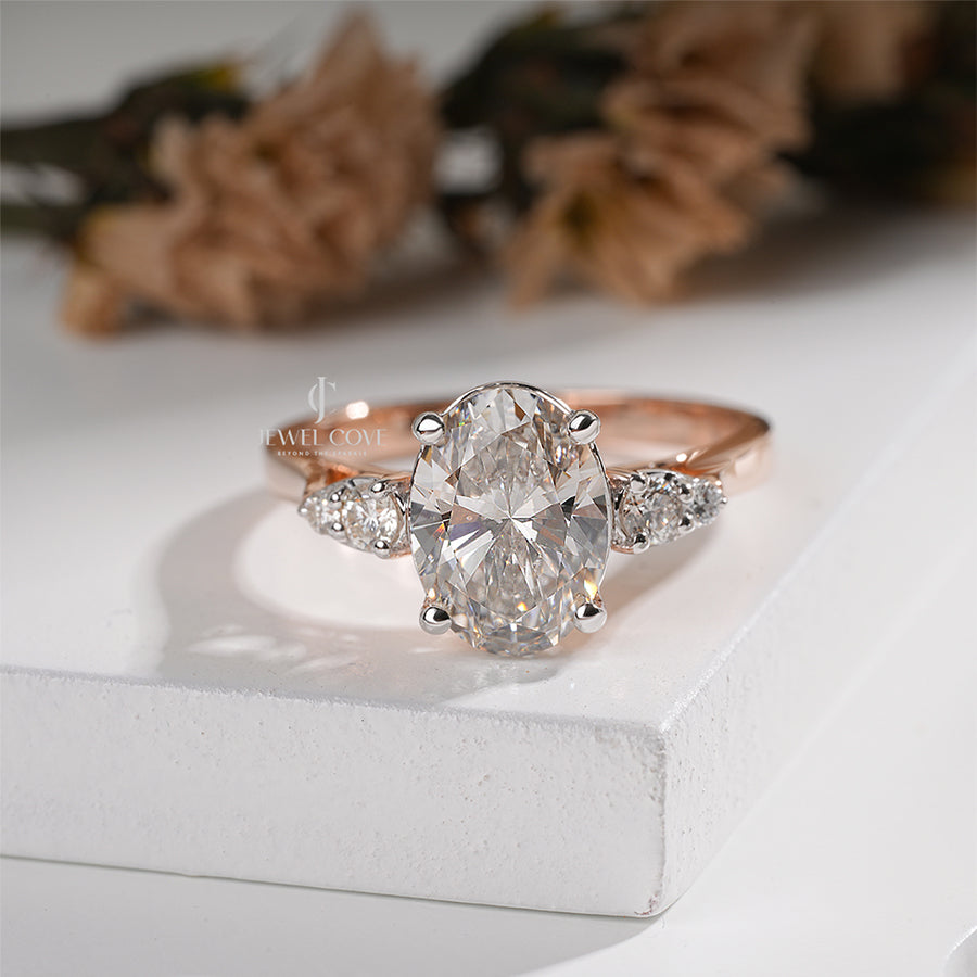 Exquisite Oval Diamond Ring with Tapered Round Side Stones