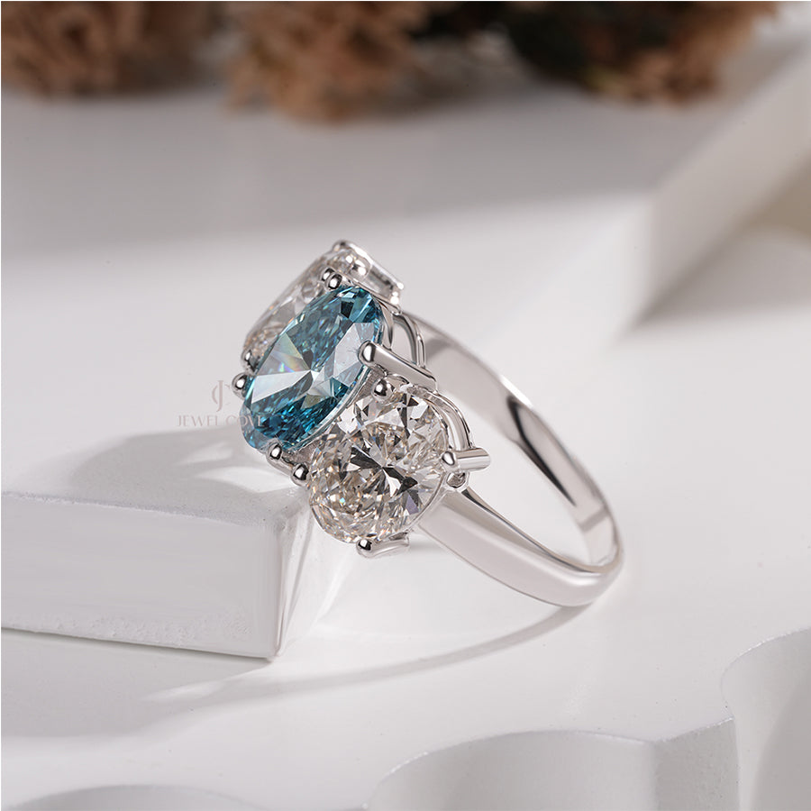 Three Stone Oval Ring with Blue Diamond and White Side Diamond