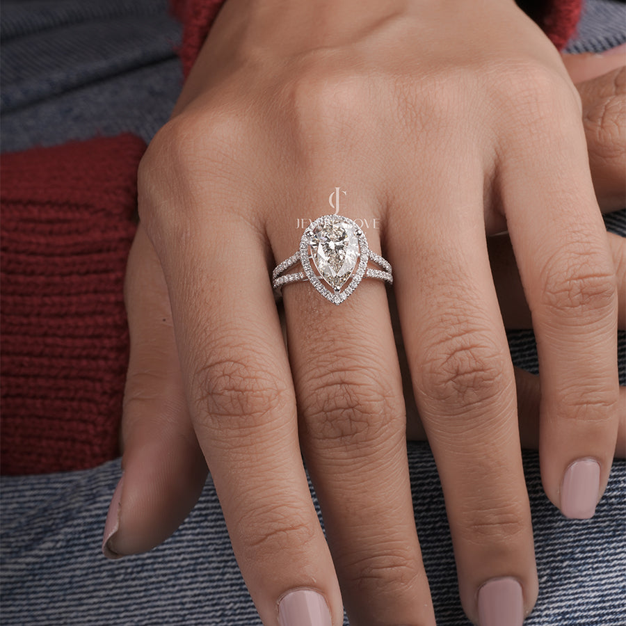 3 Carat pear diamond halo engagement ring with accent