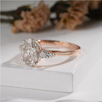 Exquisite Oval Diamond Ring with Tapered Round Side Stones