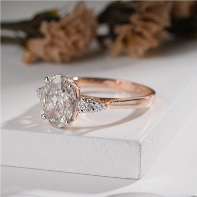 Exquisite Oval Diamond Ring with Tapered Round Side Stones