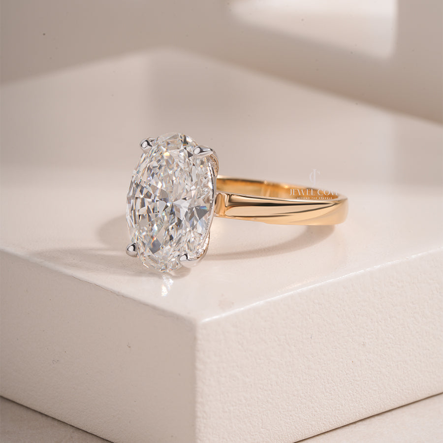 Oval Cut Diamond Engagement Ring with Classic Four-Prong Setting and Gold Band