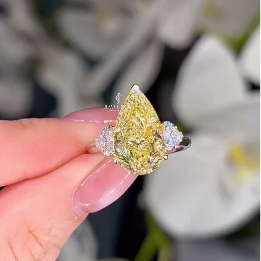 Pear Fancy Yellow 5.00tcw Moissanite Two Tone Three Stone Ring | Cathedral Setting | VVS–VS