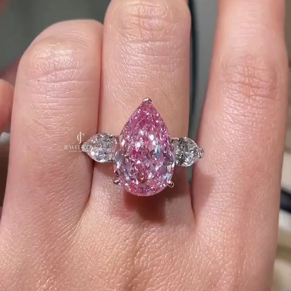 Fancy Pink 7.00tcw Moissanite Three-Stone Engagement Ring | Pear Shape | IGI Certified