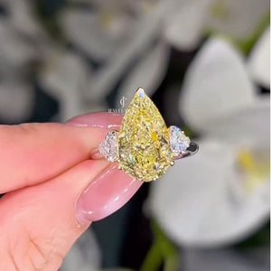 Pear Fancy Yellow 5.00tcw Lab Diamond Two Tone Three Stone Ring | Cathedral Setting | VVS–VS