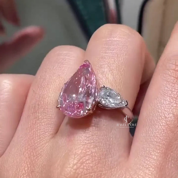 Fancy Pink 7.00tcw Moissanite Three-Stone Engagement Ring | Pear Shape | IGI Certified - hover