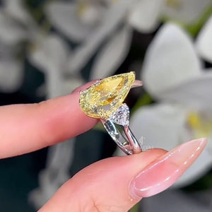 Pear Fancy Yellow 5.00tcw Lab Diamond Two Tone Three Stone Ring | Cathedral Setting | VVS–VS