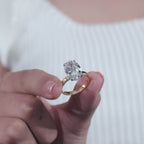 Oval Cut Diamond Engagement Ring with Classic Four-Prong Setting and Gold Band