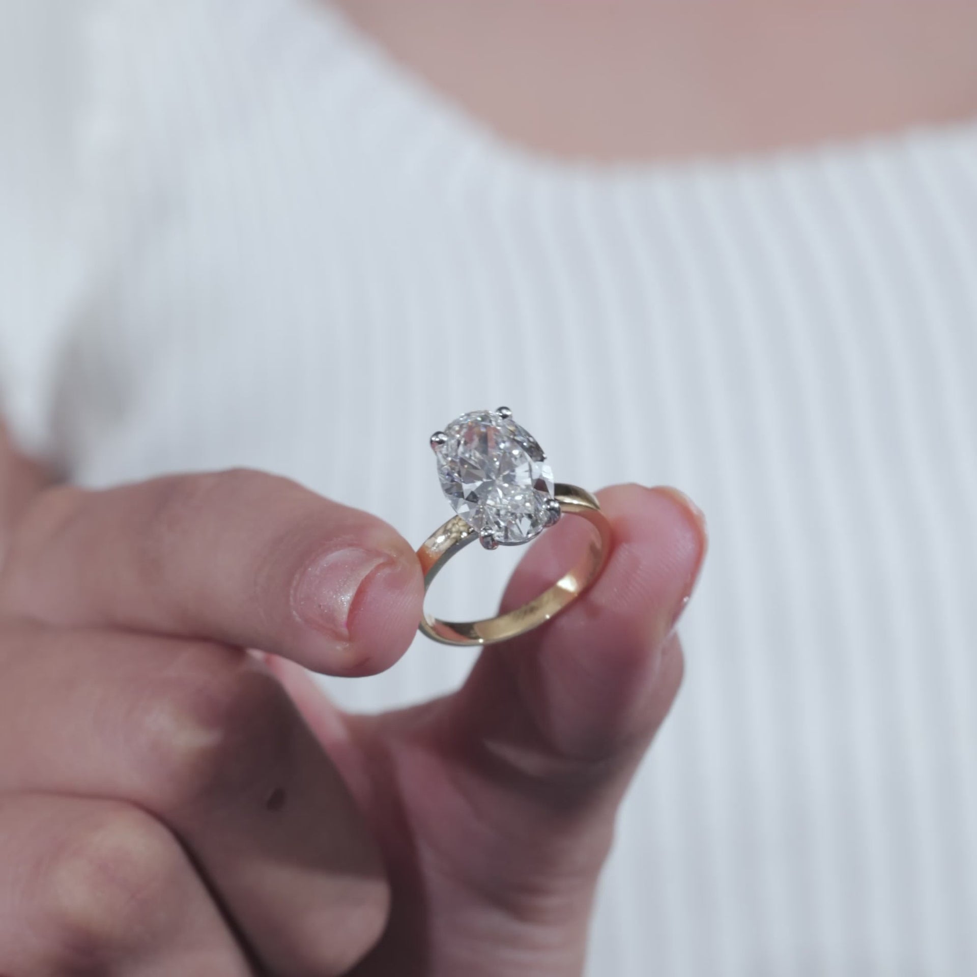 Oval Cut Diamond Engagement Ring with Classic Four-Prong Setting and Gold Band